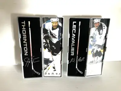 Miniature hockey sticks in collectible cases. , View more