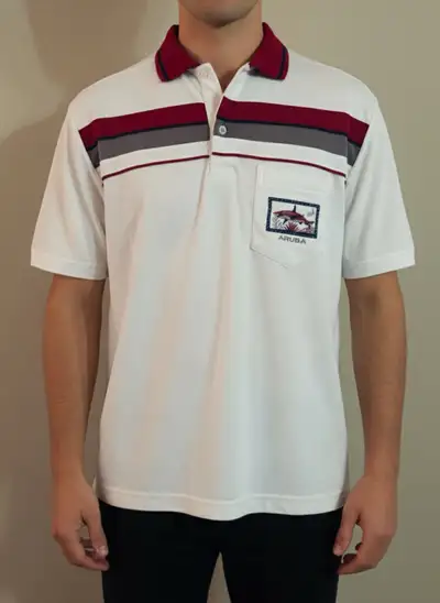 Add a touch of island flair to your wardrobe with this Monte Bello Aruba polo shirt, featuring a uni...