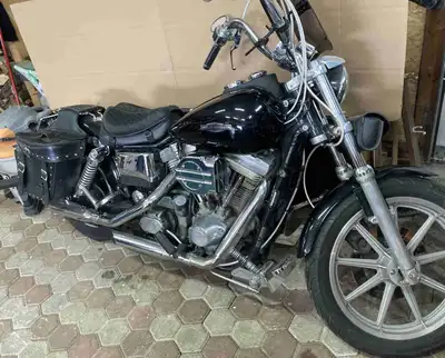 Looking to sell my '95 Harley-Davidson Dyna Low Rider, a true classic with a sleek black finish and...