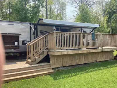 2017 32’ Bunkhouse triple slide. Trailer is located on a large lot at Stanley Park Campground on Man...