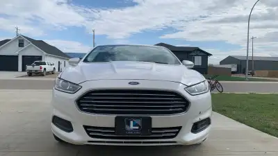 Selling my 2014 ford fusion 1.5 se fwd it has 291,000 km it runs and drives good it has a check engi...