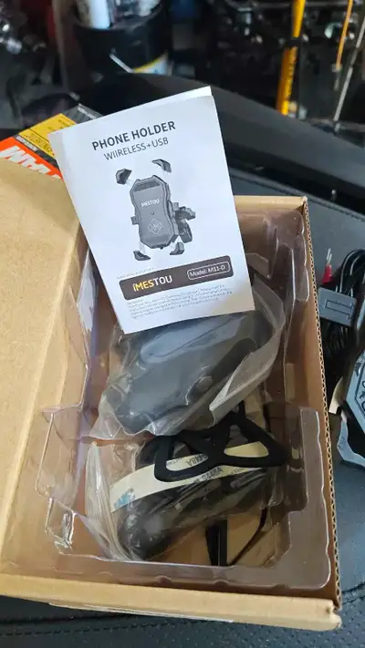 Phone holder with USB wireless charger mounting kits etc. brand new never used or mounted. Came with...