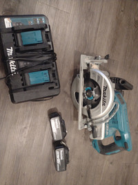 Makita 7 1/4 inch rear handle saw, batteries and charger