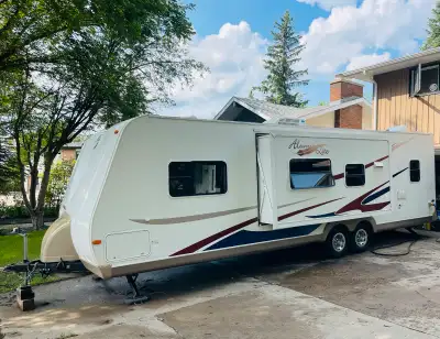 Half ton towable 29foot, 7600lbs holiday rambler Aluma-lite trailer with 1slide. Front walk around q...
