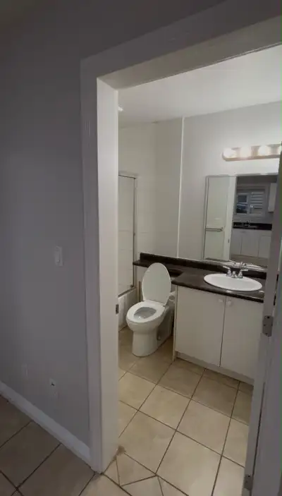 This clean and well-maintained basement apartment features a private bedroom with neutral carpeting...