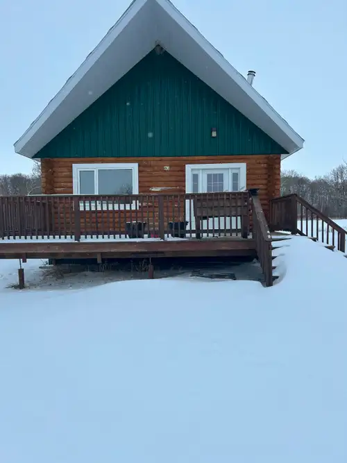 Escape to the lake with this beautifully crafted 24’ x 26’ log cabin located in the heart of Carlton...