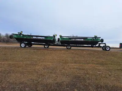 Trailtech header trailer. Has 4 mounting brackets. It was designed for a 36 foot header. Rear axle i...