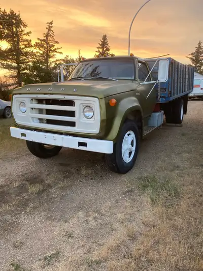 3 ton dump truck has 361 gas motor , 5 speed gearbox, 2 speed rear end , running good, good glass ,4...