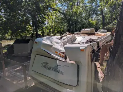 Badly damaged due to a tree falling on the front. It's free but you come and get it. It's not plated...