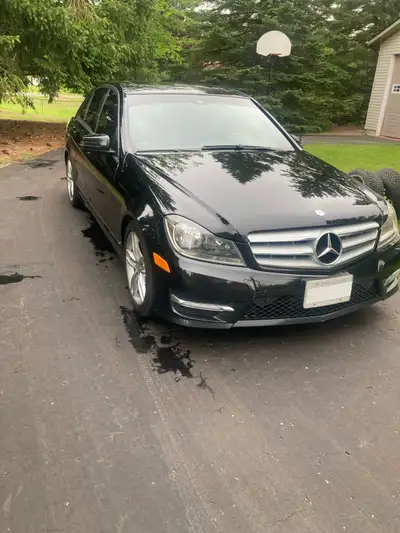 This sleek black 2013 Mercedes-Benz C-Class 300 sedan. It is in great working order with 200,000km ,...