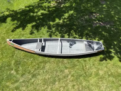 Selling a solid and dependable Scott 14’ Bushman fiberglass canoe with a square stern/flat back tran...