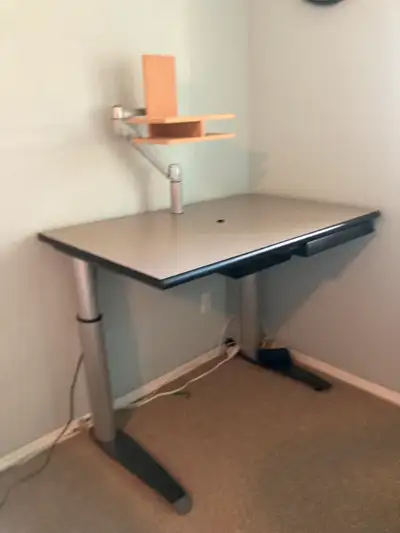 For sale is this electric standing desk with pullout lockable drawer. Priced for a quick sale - movi...