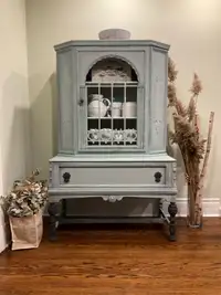 China/Linen Cabinet restyled in neutral blue and black wax