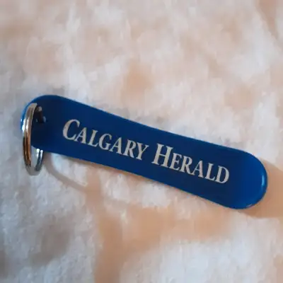 Calgary Herald 2000s snow board key chain blue zipper toggle, View more