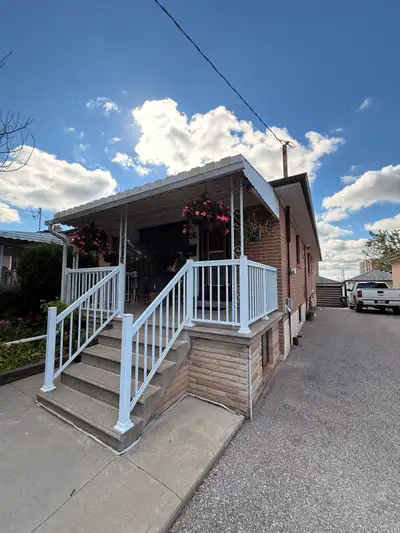 Beautiful, clean, and well-maintained home with a modern kitchen featuring white cabinetry, quartz-s...