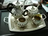 FOUR PIECE SILVER PLATE SERVICE WITH TRAY