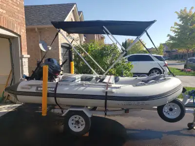 Inflatable boat with 20hp Yamaha motor and trailer. Nice 12.5' boat for fishing with low hours on mo...