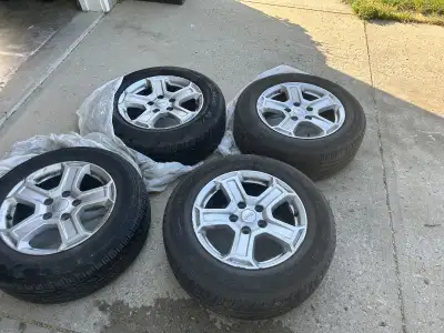 Jeep wrangler rims and tires for sale. 5x5 bolt pattern 44.5 offset. Rims are a little scratched up...