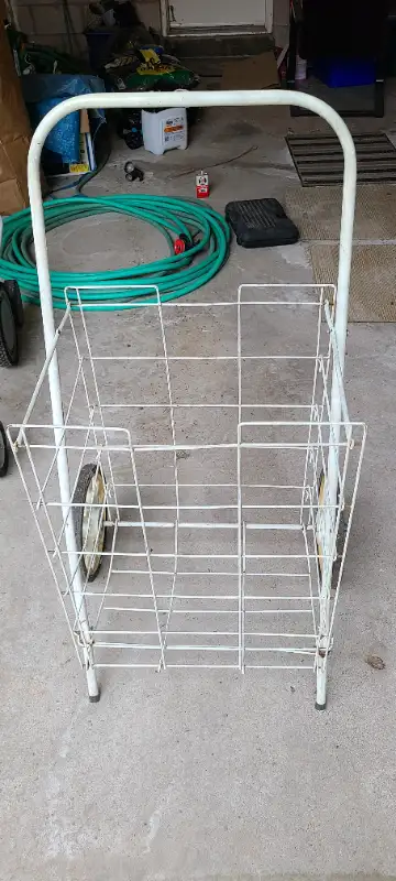 Used. Larger wheels in good condition. Sturdy frame. Great for carrying groceries, newspapers, etc....