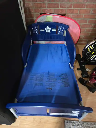 Movong sale!! This is a gently used Delta Children Toronto Maple Leafs Plastic Toddler Bed, perfect...