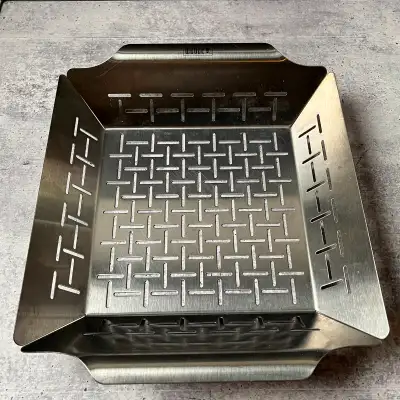 430-Grade stainless steel for heat retention and durability 1/8-Inch slits allow juices to flow out...