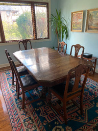 Solid wood dining table and 6 chairs with black leather seats