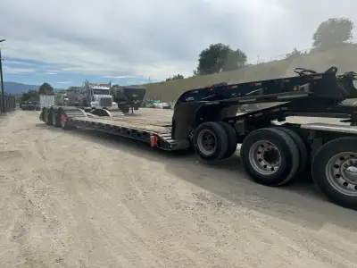 10' wide, 24' well Hydraulic Neck, will fit up to tri-drive truck Hydraulic flip c/w 1999 Peerless j...