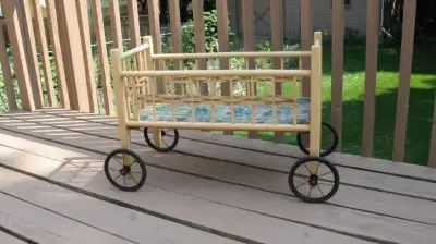 ANTIQUE DOLL CRIB ON WHEELS, View more