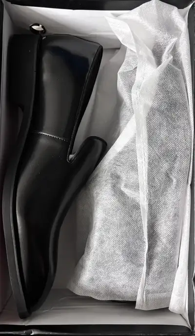 Step out in style with these brand new men’s dress shoes! These sleek, black loafers feature a moder...
