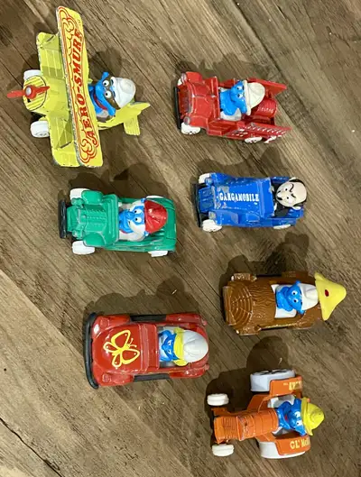7Vintage Ertl die-cast Smurf character cars produced around 1982, View more