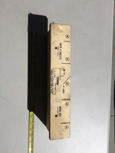 This is a Mita Mitre Box that allows you to make angled cuts in a variety of materials. It's in used...