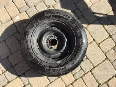 Spare tire. See picture for tread wear. Stored inside
