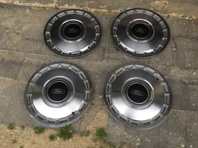 Set of 4 Ford stainless steel , not plastic ,14 inch wheel covers.Great for trailer wheels or if you...