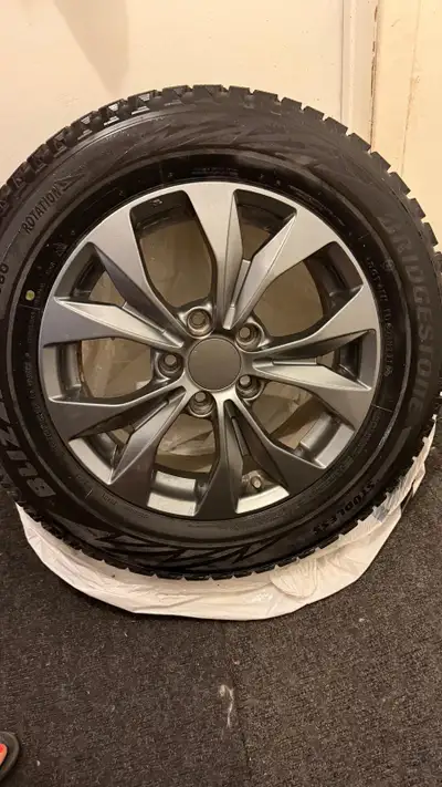 Selling a complete set of 4 Bridgestone Blizzak WS80 winter tires mounted on mags, -Bridgestone Bliz...