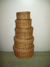 A   set 5 baskets  with lids all fit inside each other