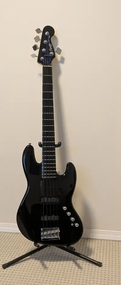 This is a Squier Vintage Modern active 5 string Jazz Bass. Good used condition with black tape wound...