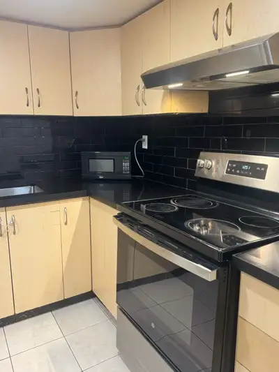 Features: Separate entrance, approximately 1280 sq feet of living space, open concept kitchen and li...