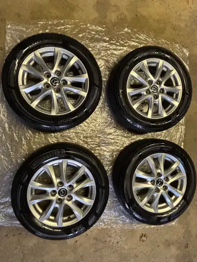 Motomaster 205 60 R16 Tires with Mazda Rims for sale. Rims are in great condition. Tires have 75% tr...