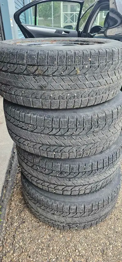 Set of 4 winter tires on rims. Will fit 2017 Ford Escape. Tires are BF Goodrich with 6/32nd tread re...