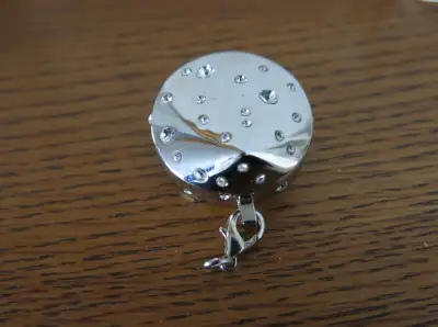 From a pet free and smoke free home. For sale is a SWAROVSKI CRYSTAL TOUCH MAKE UP JEWEL / LOCKET. T...