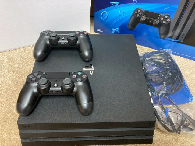PS4 Pro 1TB with 2 controllers and charger in Sony Playstation 4 in Burnaby/New Westminster