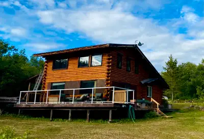 ⸻ Beloved Multigenerational Cabin Retreat on Rare 2-Acre In-Town Lot in Atlin, BC Welcome to a truly...