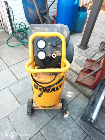 I'm selling a DeWalt 15-gallon portable air compressor, perfect for various tasks with its 1.6 HP mo...