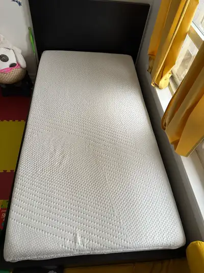 Twin bed with a mattress, View more