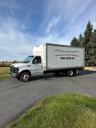 • Minoru Truck Bodies cube box with roll-up rear door • Plywood-lined interior with E-track rails on...