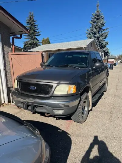 $3000.00 OBO Priced to sell 4 door Ford F150 XLT 4x4. Grey Paint and Clean Grey interior Triton V8 5...
