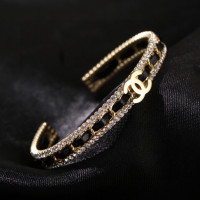 New Channel black leather braided golden bracelet