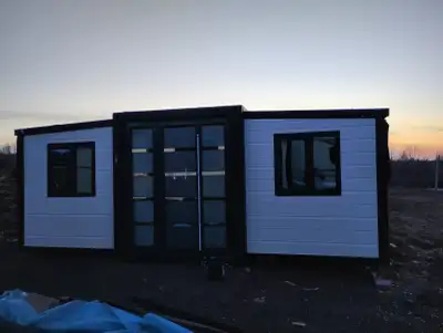 Cottage for sale.25x20 container home with roof and deck package. 5 acres was mulched down and level...