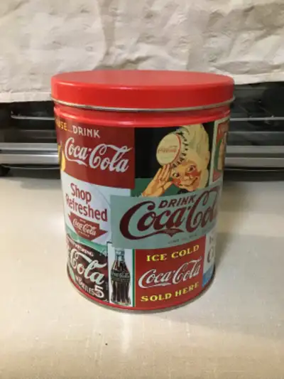 Collectable Coca Cola tins The big one is $20 lid has some bents in it The smaller one $10 The juke...
