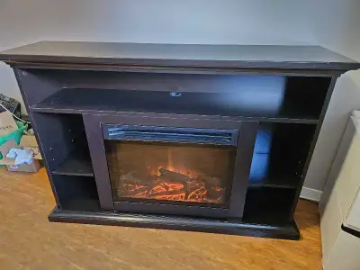 Masterflame electric fireplace/TV stand. Good condition some minor wear and tear. The fireplace inse...